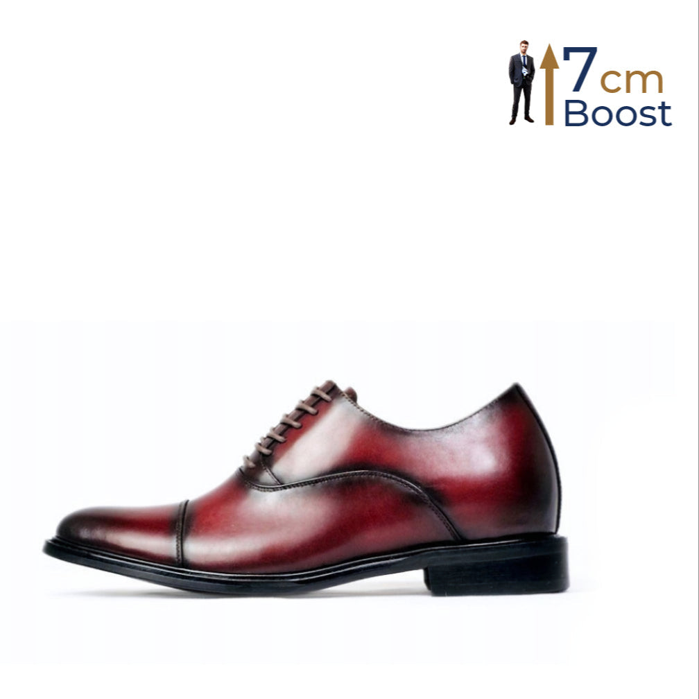 A single red leather dress elevator shoe with lace-up closure, displayed against a white background with a man in the background indicating a height increase of 7cm.