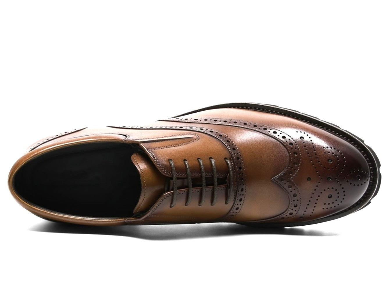 Brown leather dress shoe on a white background