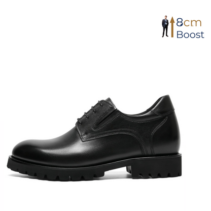 Black leather shoe with a 8cm boost feature on a white background